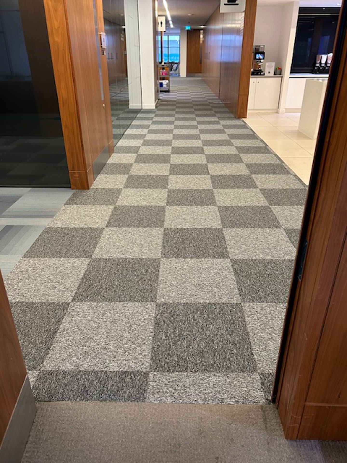 Office corridor after carpet tile replacement