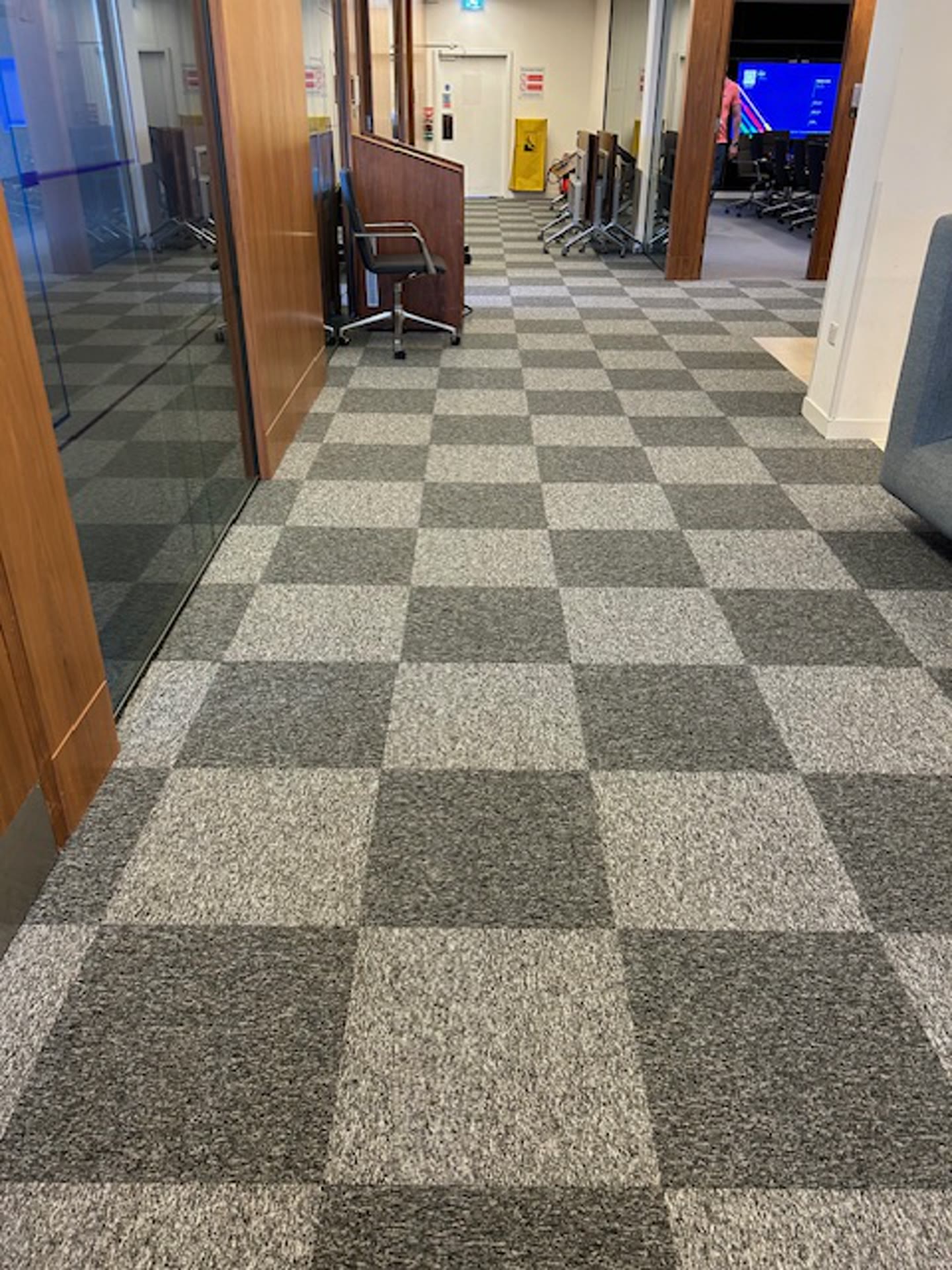 Circulation corridor after carpet tile replacement