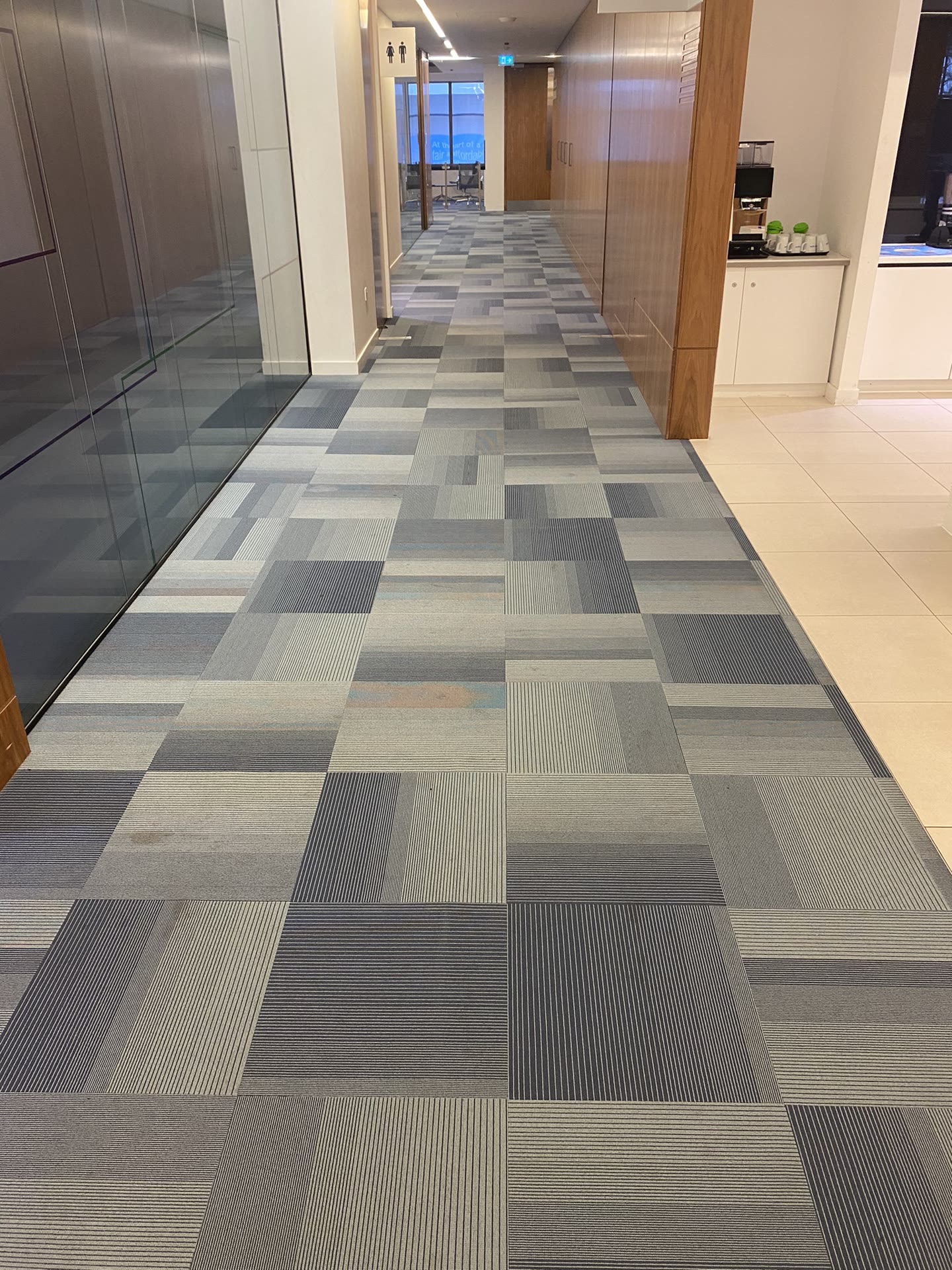 Office corridor before carpet tile replacement