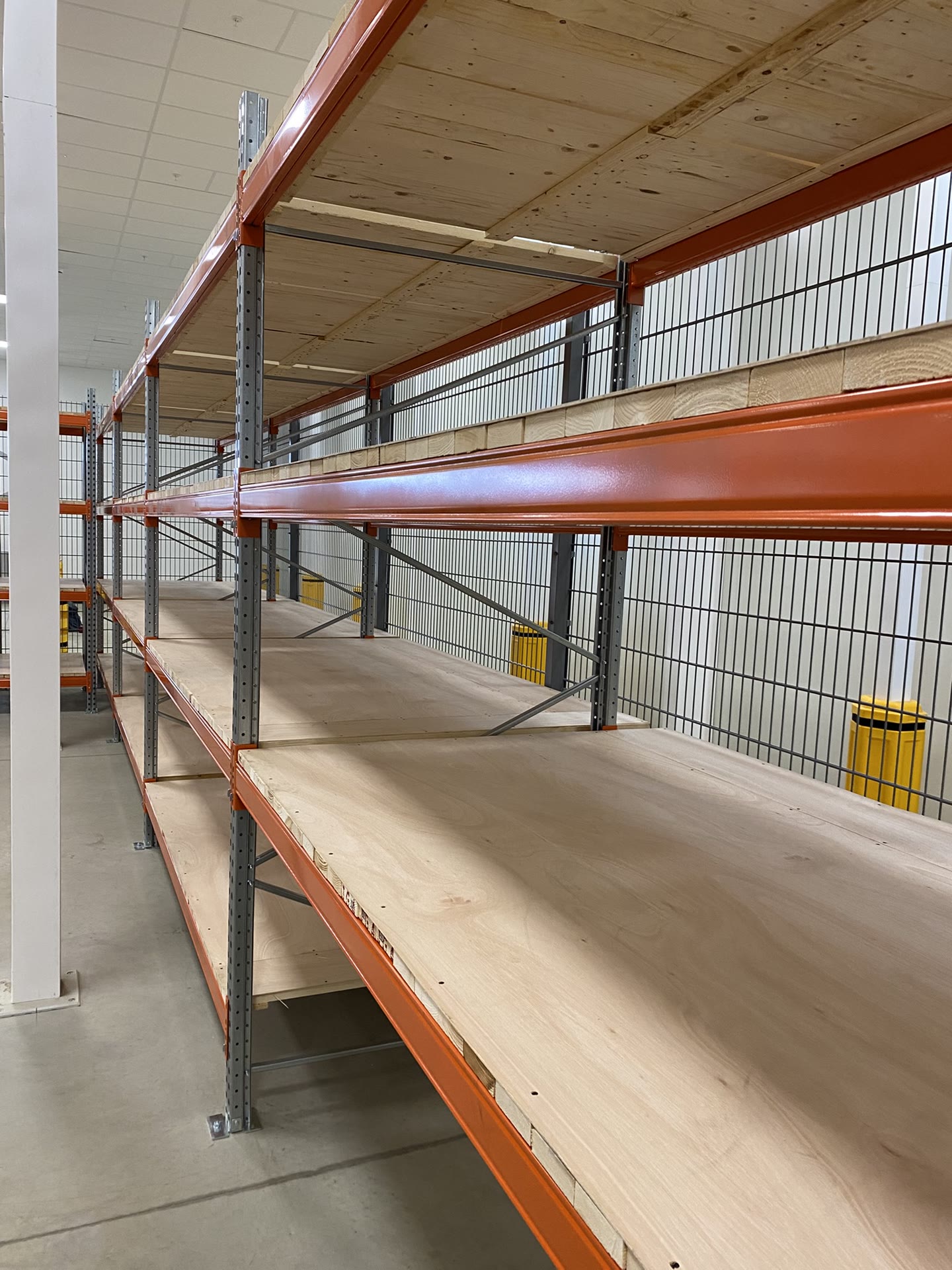 Close-up of pallet racking beams and timber decking