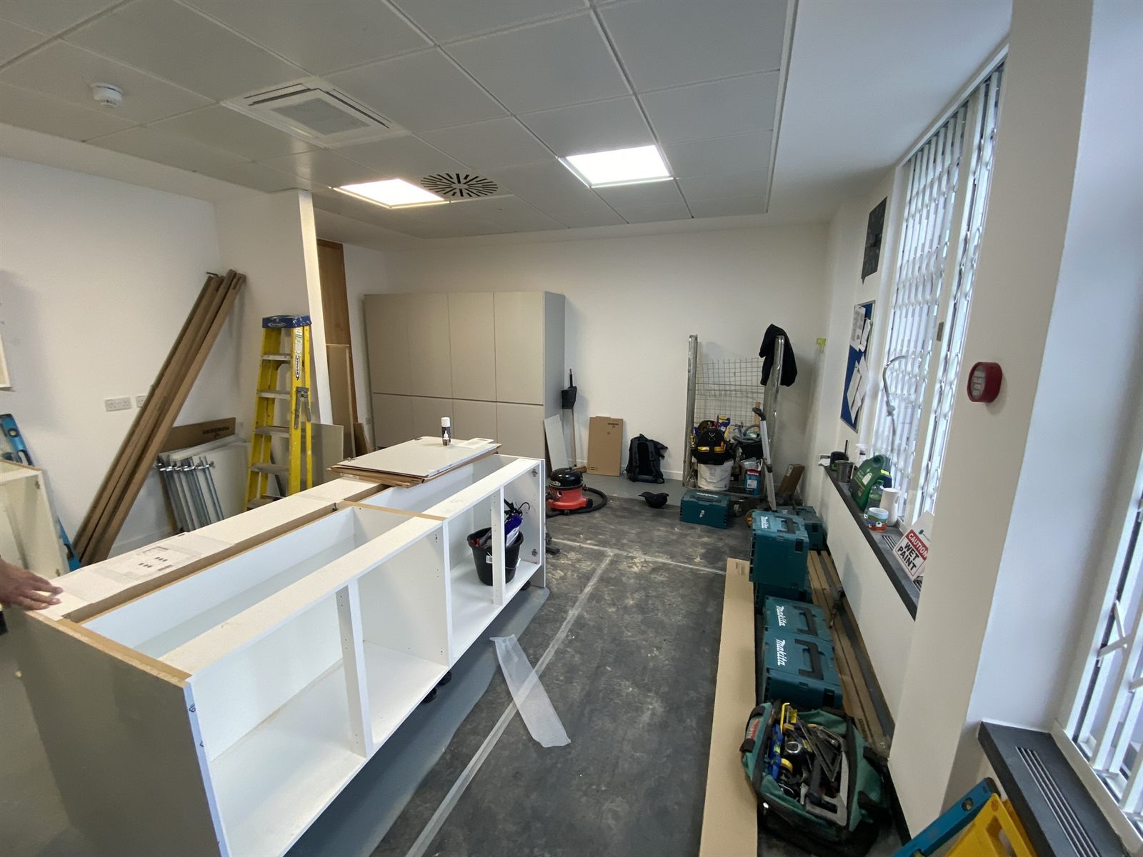 Kitchen refurbishment in progress with units being installed