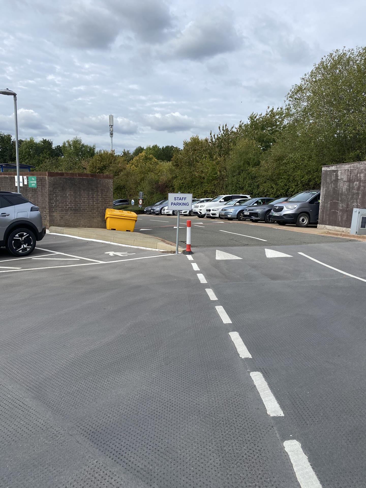 Staff parking access road with directional line marking